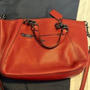 Coach bag. Red, can be used as a Crossbody, or handles for hand carrying.